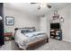 Cozy bedroom with soft gray walls, a ceiling fan, a comfortable bed, and plush carpet flooring at 1531 W Campo Bello Dr, Phoenix, AZ 85023