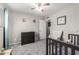 Bedroom with a crib, hardwood floors and a dresser at 1531 W Campo Bello Dr, Phoenix, AZ 85023