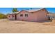 Charming single-story home featuring a muted pink brick exterior, a covered front porch, and low-maintenance landscaping at 1531 W Campo Bello Dr, Phoenix, AZ 85023