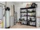 Utility storage room with water tank, water softener, shelves and household supplies at 1531 W Campo Bello Dr, Phoenix, AZ 85023