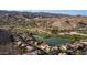 Aerial view of beautiful lakeside homes, golf course, and greenbelt with mountain views at 16239 S 18Th Pl, Phoenix, AZ 85048