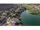 Aerial view of lakeside homes and golf course in a lush community with mountain views at 16239 S 18Th Pl, Phoenix, AZ 85048
