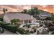 Beautiful backyard with pool, patio, tiered landscaping, and mountain views perfect for entertaining or relaxation at 16239 S 18Th Pl, Phoenix, AZ 85048