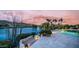 Stunning backyard oasis with a pool, a lake view, and steps to a patio at 16239 S 18Th Pl, Phoenix, AZ 85048