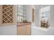 Charming bar area with custom cabinetry, glass shelving, and a wine rack, perfect for entertaining at 16239 S 18Th Pl, Phoenix, AZ 85048