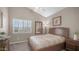 Comfortable bedroom with a window seat, ample natural light, and neutral decor at 16239 S 18Th Pl, Phoenix, AZ 85048