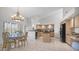 Eat in kitchen features a dining table and an island and stainless steel appliances at 16239 S 18Th Pl, Phoenix, AZ 85048