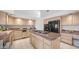 Spacious kitchen boasts an island cooktop, stainless steel appliances, and plenty of counter space and storage at 16239 S 18Th Pl, Phoenix, AZ 85048