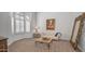 Bright living room showcasing neutral tones, elegant furniture, and large windows with shutters at 16239 S 18Th Pl, Phoenix, AZ 85048