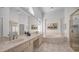 Luxurious main bathroom with a soaking tub, dual sinks, and a glass-enclosed shower at 16239 S 18Th Pl, Phoenix, AZ 85048