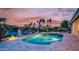 Gorgeous backyard pool with views of the lake and palm trees at 16239 S 18Th Pl, Phoenix, AZ 85048