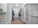 Large walk-in closet with ample built-in shelving and storage space, providing organization and convenience at 16239 S 18Th Pl, Phoenix, AZ 85048