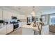 Contemporary kitchen featuring white cabinets, stainless steel appliances, and a center island at 16743 W Charlotte Dr, Surprise, AZ 85387