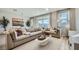 Inviting living room with large windows and comfortable seating arrangements at 16743 W Charlotte Dr, Surprise, AZ 85387