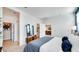 Bright bedroom with neutral tones and a view into the living area at 16762 W Alameda Rd, Surprise, AZ 85387