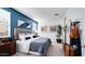 Stylish bedroom featuring a blue accent wall and contemporary decor at 16762 W Alameda Rd, Surprise, AZ 85387