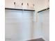 A walk-in closet is displayed, featuring white walls, a wood closet rod and shelves with baskets at 16762 W Alameda Rd, Surprise, AZ 85387