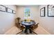Cozy dining area with a round table and stylish chairs under natural light at 16762 W Alameda Rd, Surprise, AZ 85387