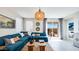 Bright living room with a large sectional and sliding glass doors to the backyard at 16762 W Alameda Rd, Surprise, AZ 85387