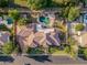 A stunning estate with a backyard oasis, boasting a rock waterfall pool, manicured lawn, and mature trees at 1758 E Carver Rd, Tempe, AZ 85284