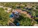 A private retreat featuring a covered patio and a luxurious pool with rock waterfall, nestled in lush greenery at 1758 E Carver Rd, Tempe, AZ 85284