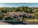 Expansive property featuring a well-manicured lawn, mature trees, and a grand home with a tile roof at 1758 E Carver Rd, Tempe, AZ 85284