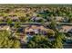 Expansive aerial view of estate-style home with pool, play area and mature trees on a large lot at 1758 E Carver Rd, Tempe, AZ 85284