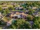 Luxury home with a resort-style backyard featuring a pool with rock waterfall and a spacious covered patio at 1758 E Carver Rd, Tempe, AZ 85284