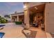 Expansive backyard featuring a covered patio, built-in grill, and lush landscaping for outdoor enjoyment at 1758 E Carver Rd, Tempe, AZ 85284