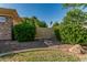 Landscaped backyard with lush greenery and pathway leading to a private gate or entrance at 1758 E Carver Rd, Tempe, AZ 85284