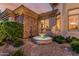 Backyard space boasting a stone water feature, desert landscaping, and exterior stone accents at 1758 E Carver Rd, Tempe, AZ 85284