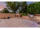 Well-maintained backyard featuring a built-in grill and fireplace, perfect for outdoor gatherings and entertainment at 1758 E Carver Rd, Tempe, AZ 85284