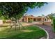 Backyard featuring a playground, grassy area, and landscaping, perfect for Gathering activities and outdoor enjoyment at 1758 E Carver Rd, Tempe, AZ 85284