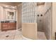 Bright bathroom with shower, glass block feature, granite counters and decorative mirror at 1758 E Carver Rd, Tempe, AZ 85284