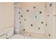 Cozy bathroom featuring a tiled shower with decorative accents and a classic toilet at 1758 E Carver Rd, Tempe, AZ 85284