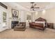 Main bedroom suite with a fireplace, sitting area, and ornate wooden furniture at 1758 E Carver Rd, Tempe, AZ 85284