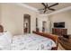 Primary bedroom with tray ceilings, a sitting area, and an en-suite bathroom at 1758 E Carver Rd, Tempe, AZ 85284