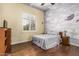 Cozy bedroom with whimsical mural, shutters, and hardwood floors at 1758 E Carver Rd, Tempe, AZ 85284