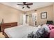 Primary bedroom with neutral carpet and warm paint, featuring an adjacent bathroom at 1758 E Carver Rd, Tempe, AZ 85284