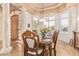 Elegant dining room featuring marble floors, decorative columns, and a large dining table at 1758 E Carver Rd, Tempe, AZ 85284