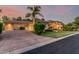 Beautiful home with well-manicured lawn, mature palm trees, desert landscaping and a spacious driveway at 1758 E Carver Rd, Tempe, AZ 85284