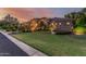 Expansive front yard showcasing lush green grass, desert landscaping, and a charming single-story home at 1758 E Carver Rd, Tempe, AZ 85284