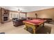 Open basement living area featuring a brick fireplace and game room at 1758 E Carver Rd, Tempe, AZ 85284