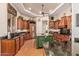 Spacious kitchen boasts stainless steel appliances, a green kitchen island, and abundant counter space at 1758 E Carver Rd, Tempe, AZ 85284