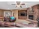 Basement living room featuring a fireplace and built-in entertainment center at 1758 E Carver Rd, Tempe, AZ 85284