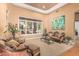 Cozy living room with a large window, neutral colors, ornate furniture, and plush carpeting at 1758 E Carver Rd, Tempe, AZ 85284