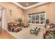 Elegant living room with ornate furniture, neutral colors, large window, and a plush carpet at 1758 E Carver Rd, Tempe, AZ 85284