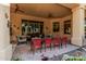 Well-appointed covered patio with multiple seating areas and views of the backyard at 1758 E Carver Rd, Tempe, AZ 85284