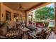 Covered patio featuring comfortable seating and views of the pool and landscaping at 1758 E Carver Rd, Tempe, AZ 85284