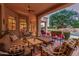 Expansive covered patio with seating area overlooking the pool and waterfall, great for relaxing and entertaining guests at 1758 E Carver Rd, Tempe, AZ 85284